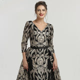 ASRAH, this beautiful v neckline floor length black and silver evening dress has a stunning damask print design all over the dress.