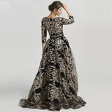 ASRAH, this beautiful v neckline floor length black and silver evening dress has a stunning damask print design all over the dress.